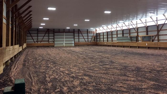 An indoor horse riding arena.
